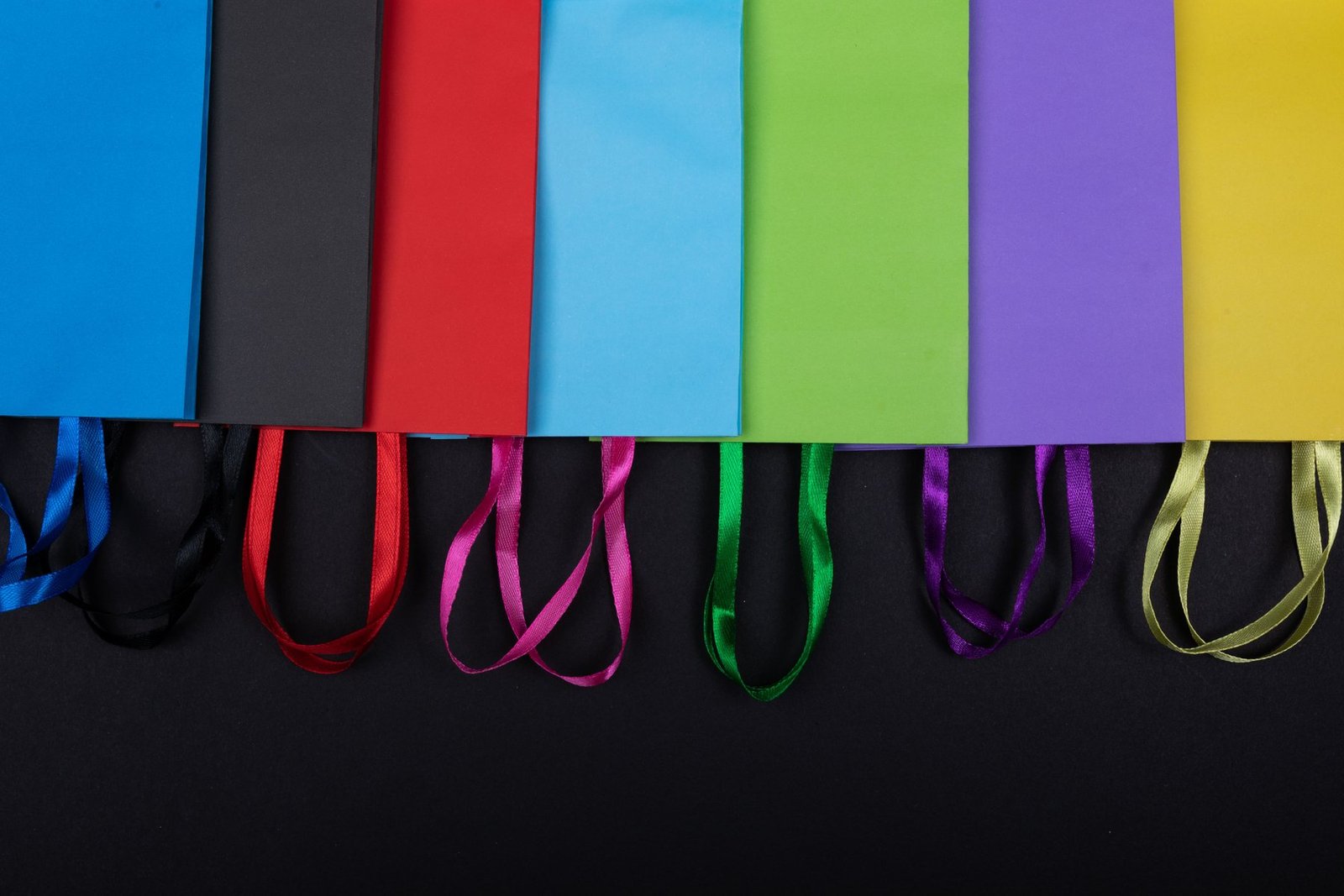 Colored paper bags illustrating how substrate color changes the visual result