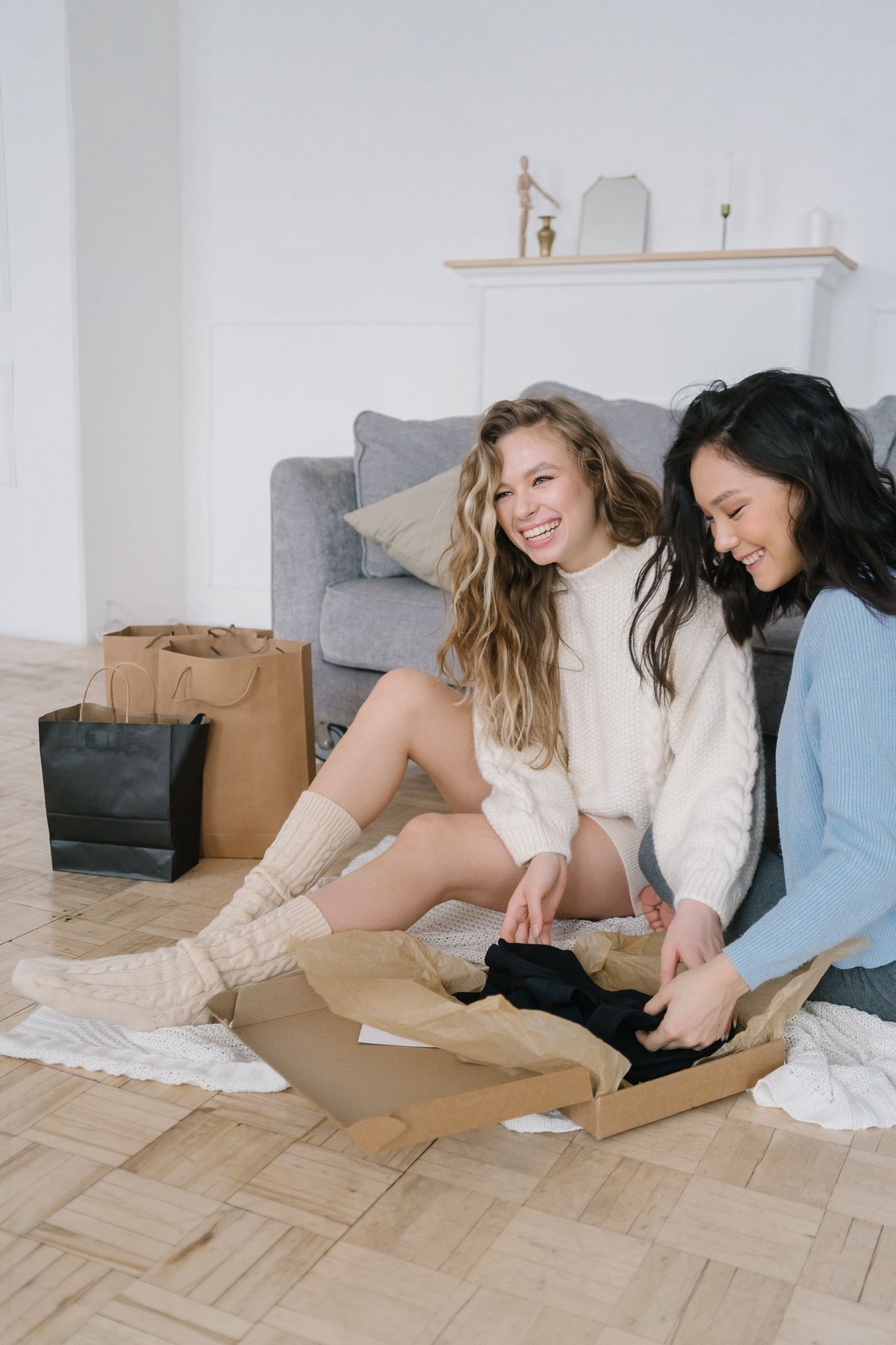 Two people opening a delivered box together at home
