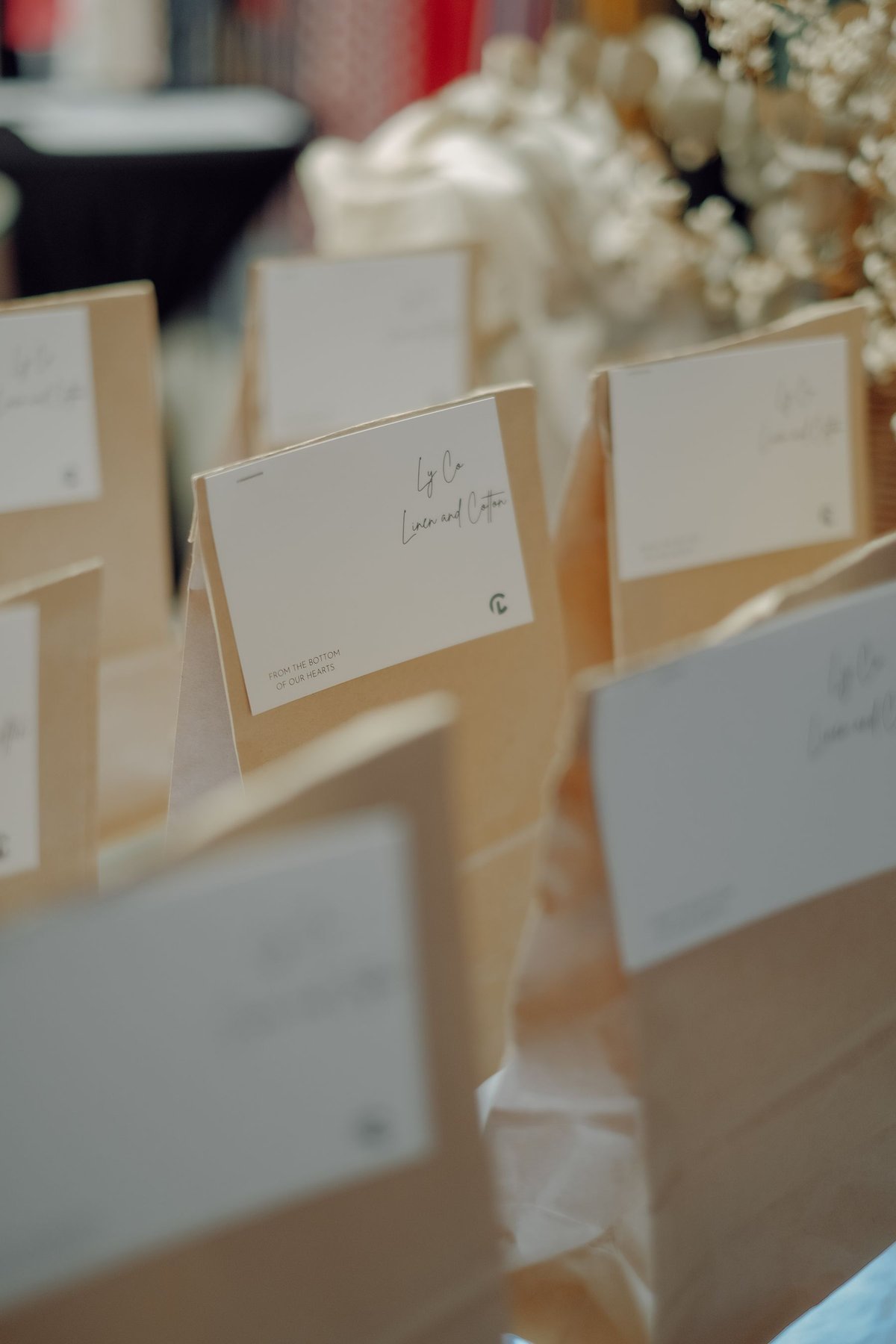 Rows of brown paper gift bags carrying individual tags