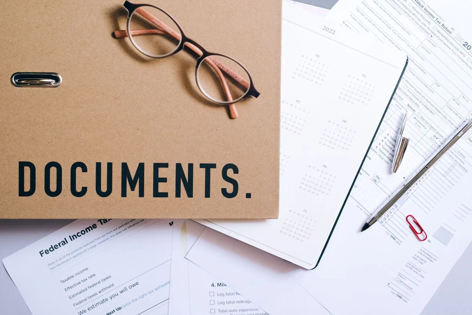 Documents and planning tools arranged on a desk