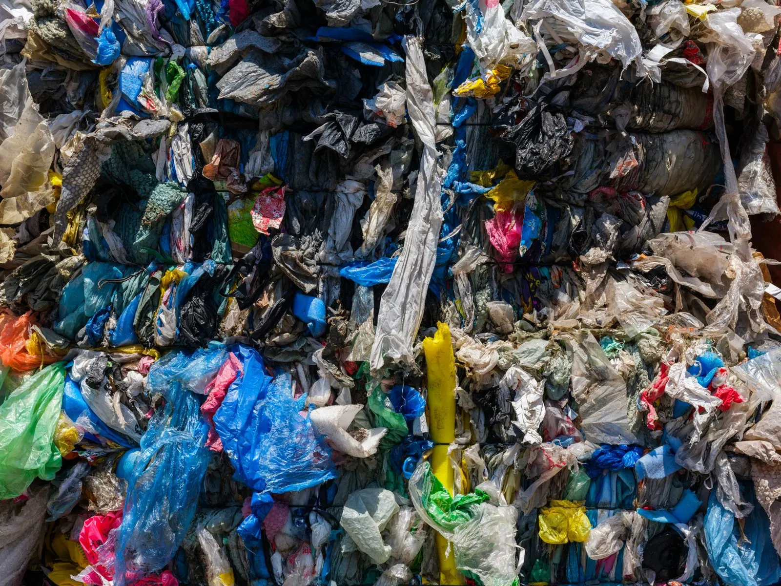 Compacted plastic materials awaiting further recycling processing