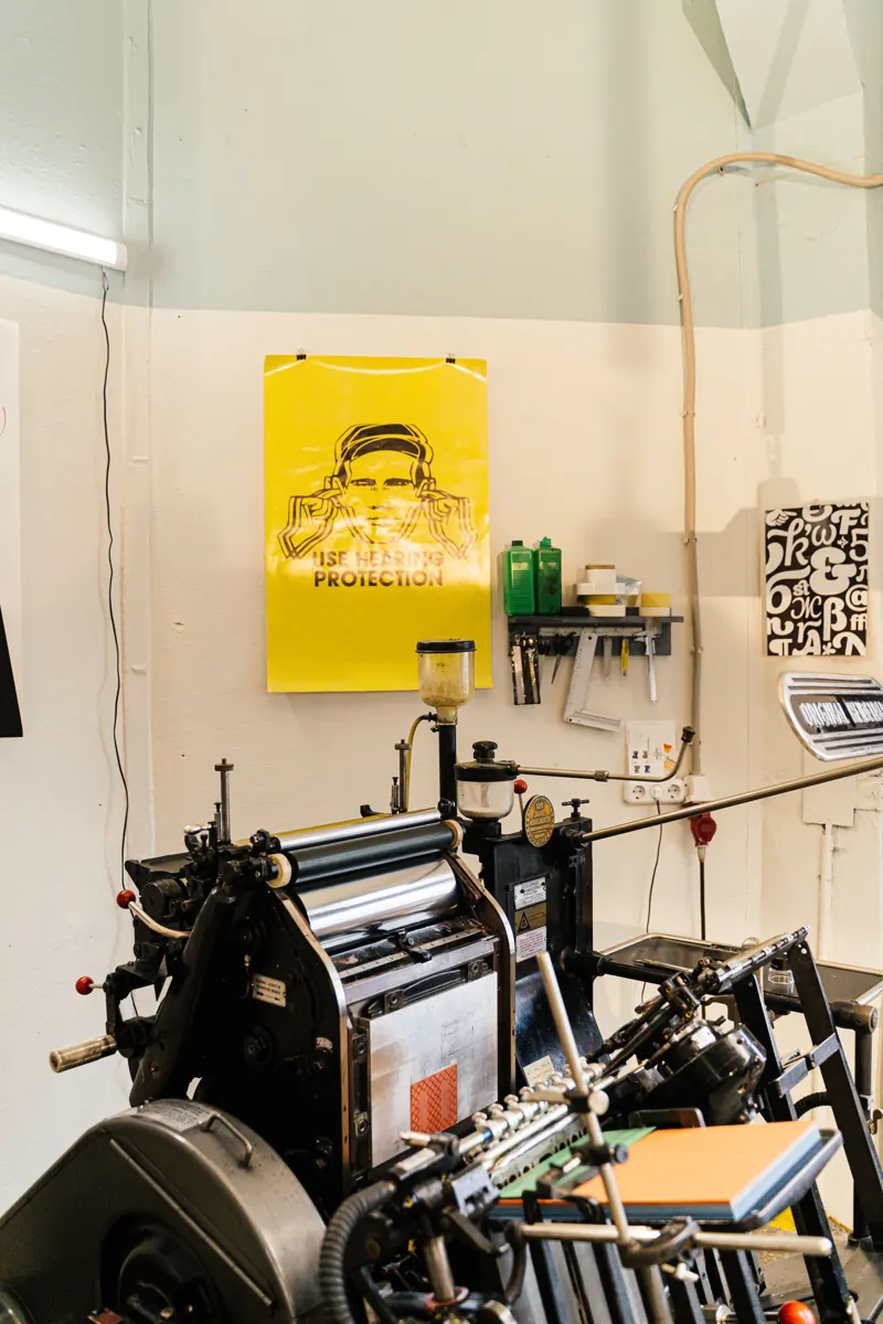 Printmaking equipment and printed sheets in a studio